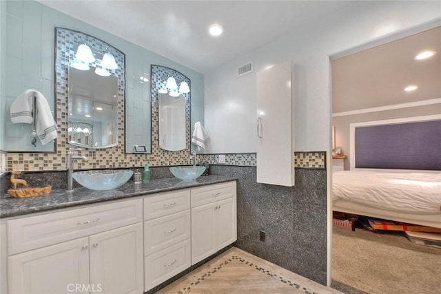 24 Edgebrook Dr, Phillips Ranch, CA 91766 - full bath featuring double vanity, tasteful backsplash, inlaid floor details, and recessed lighting