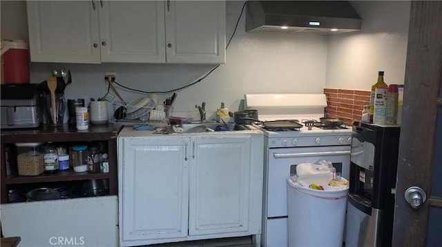 2229 Powers St, Pomona, CA 91766 - kitchen featuring gas range gas stove, range hood, white cabinetry, and backsplash