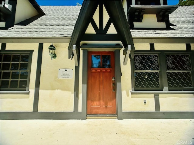 349 Golf Course Rd, Lake Arrowhead, CA 92352 - doorway to property featuring roof with shingles and stucco siding