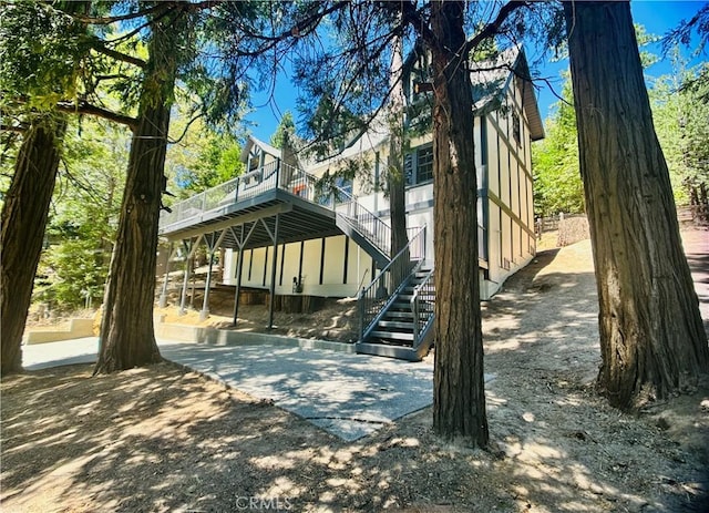 349 Golf Course Rd, Lake Arrowhead, CA 92352 - view of front facade with a wooden deck and stairs