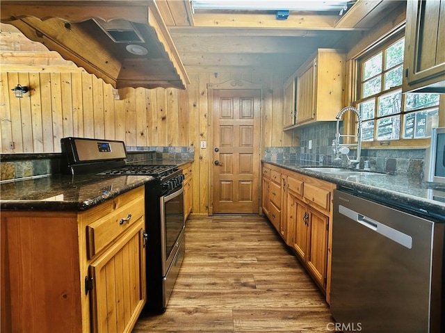 349 Golf Course Rd, Lake Arrowhead, CA 92352 - kitchen with appliances with stainless steel finishes, wood finished floors, extractor fan, backsplash, and wood walls