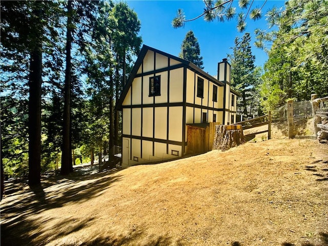 349 Golf Course Rd, Lake Arrowhead, CA 92352 - view of home's exterior featuring board and batten siding and a chimney