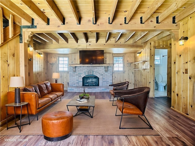 349 Golf Course Rd, Lake Arrowhead, CA 92352 - living room featuring wooden walls, wood finished floors, a wooden ceiling with exposed beams, and a fireplace