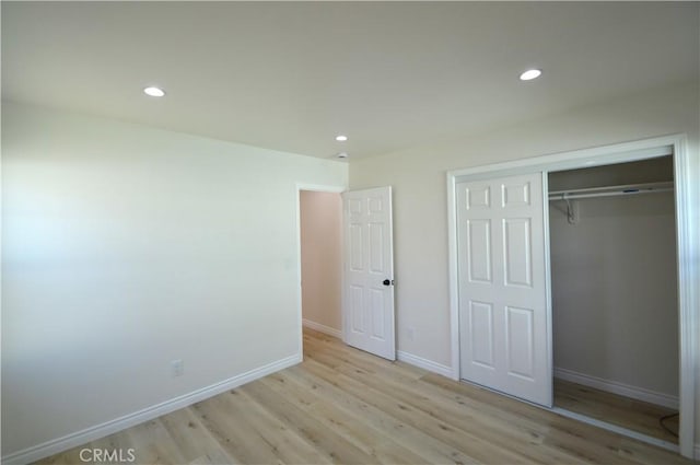 9422 Bartolo Ave, Pico Rivera, CA 90660 - unfurnished bedroom featuring light wood-style flooring, recessed lighting, and a closet