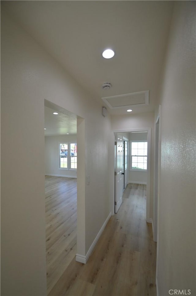 9422 Bartolo Ave, Pico Rivera, CA 90660 - corridor featuring light wood-style flooring, healthy amount of natural light, attic access, and recessed lighting