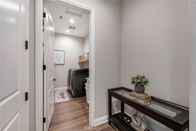 24185 Sprout Dr, Corona, CA 92883 - laundry area featuring washer and clothes dryer and wood finished floors