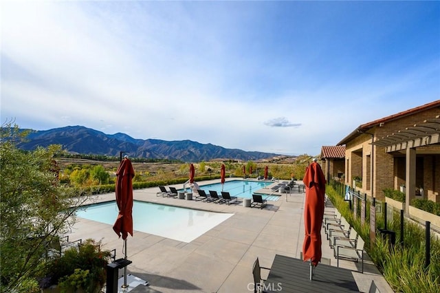 24185 Sprout Dr, Corona, CA 92883 - community pool featuring a patio and a mountain view