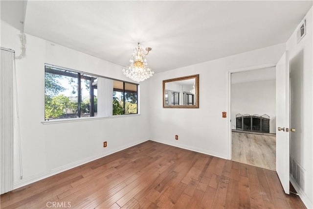 33 Edgebrook Dr, Phillips Ranch, CA 91766 - spare room with a chandelier and hardwood / wood-style flooring