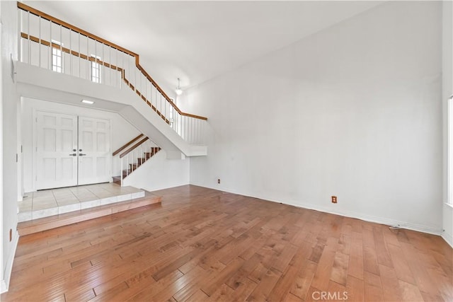 33 Edgebrook Dr, Phillips Ranch, CA 91766 - unfurnished living room with stairs and hardwood / wood-style flooring