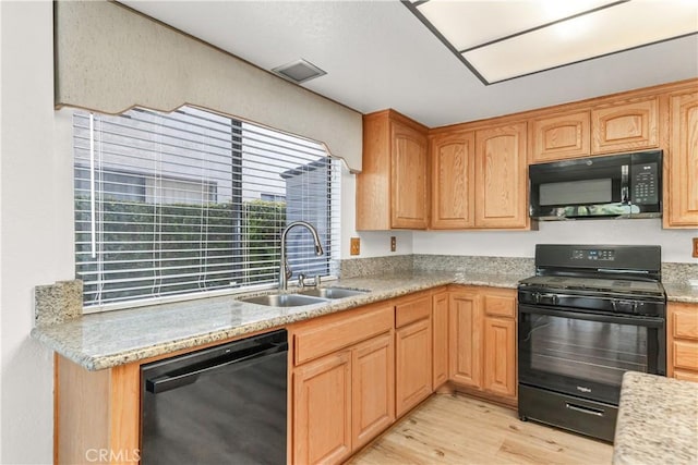 33 Edgebrook Dr, Phillips Ranch, CA 91766 - kitchen with black appliances, light wood-type flooring, and light brown cabinetry