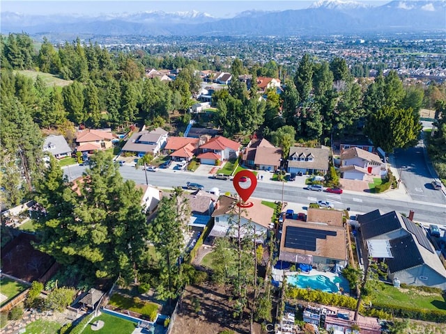 33 Edgebrook Dr, Phillips Ranch, CA 91766 - aerial view of property's location with a mountainous background and nearby suburban area