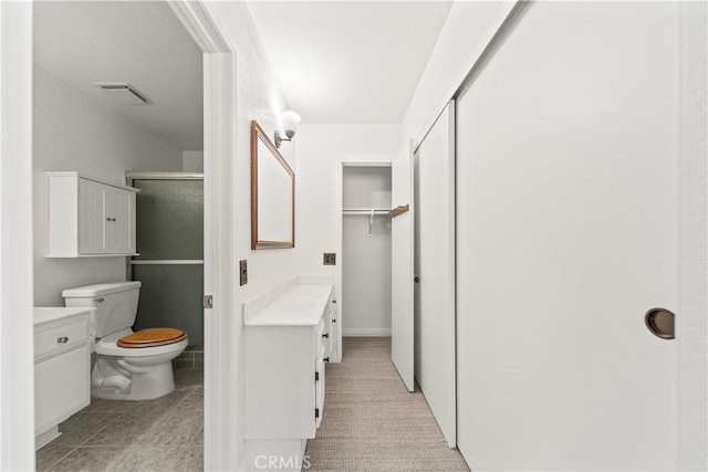 33 Edgebrook Dr, Phillips Ranch, CA 91766 - bathroom featuring vanity, a closet, and a stall shower