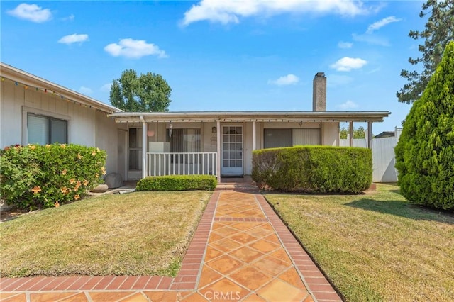 736 Highland Pl, San Dimas, CA 91773 - ranch-style home with a front lawn, a porch, and a chimney