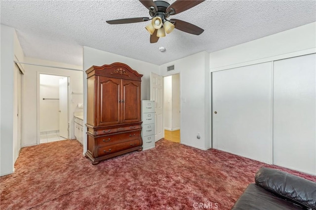 736 Highland Pl, San Dimas, CA 91773 - bedroom featuring light carpet, a closet, a textured ceiling, ceiling fan, and connected bathroom