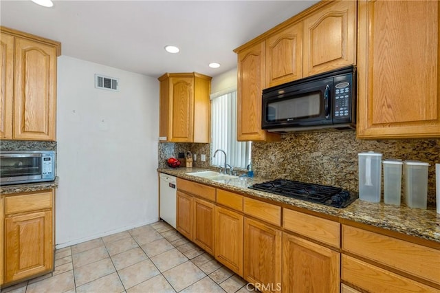 736 Highland Pl, San Dimas, CA 91773 - kitchen with black appliances, backsplash, stone counters, light tile patterned floors, and recessed lighting