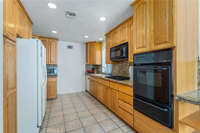 736 Highland Pl, San Dimas, CA 91773 - kitchen with black appliances, a warming drawer, tasteful backsplash, dark stone counters, and recessed lighting