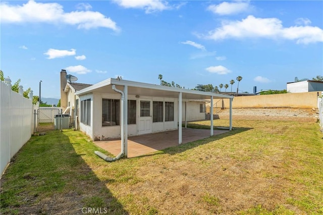 736 Highland Pl, San Dimas, CA 91773 - rear view of house with a fenced backyard, a patio area, and a sunroom