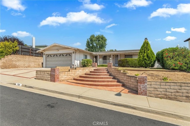 736 Highland Pl, San Dimas, CA 91773 - ranch-style home featuring a garage, concrete driveway, stucco siding, and stairway