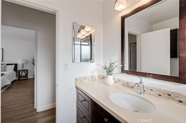 4709 W 149th St, Lawndale, CA 90260 - ensuite bathroom featuring vanity and wood finished floors