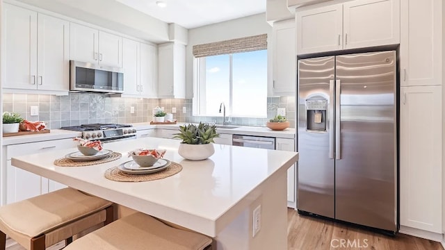 1874 S Union St Unit 28, Anaheim, CA 92805 - kitchen featuring stainless steel appliances, white cabinetry, and light countertops