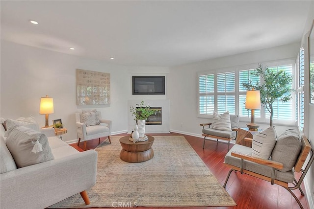 360 S Los Robles Ave Unit 10, Pasadena, CA 91101 - living area featuring dark wood-type flooring, recessed lighting, and a glass covered fireplace