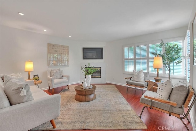 360 S Los Robles Ave Unit 10, Pasadena, CA 91101 - living area featuring dark wood-type flooring, recessed lighting, and a glass covered fireplace