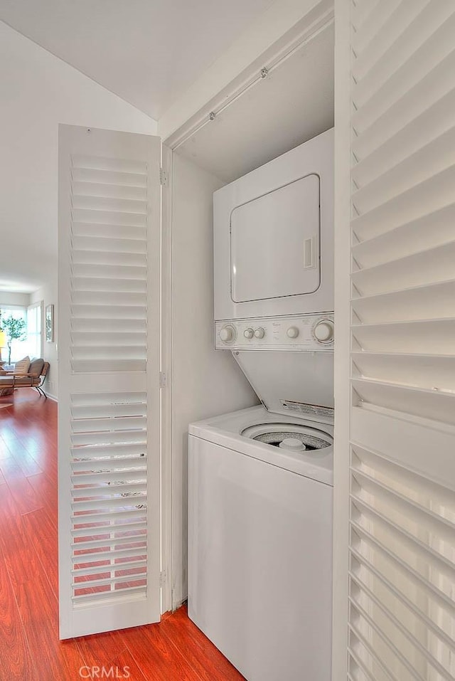 360 S Los Robles Ave Unit 10, Pasadena, CA 91101 - laundry room featuring stacked washer and clothes dryer and wood finished floors
