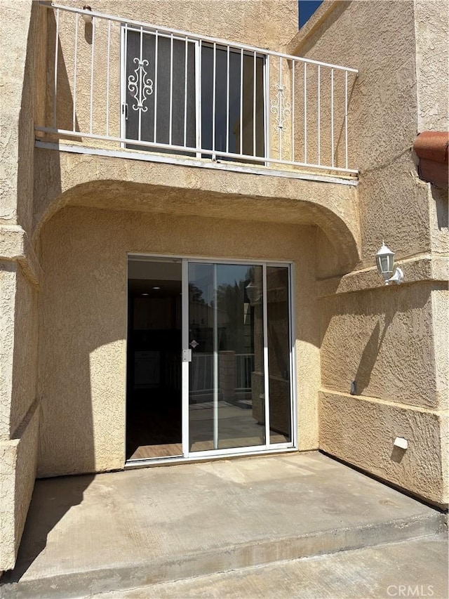 11496 Nautical Ln Unit 19, Helendale, CA 92342 - back of property featuring stucco siding and a patio