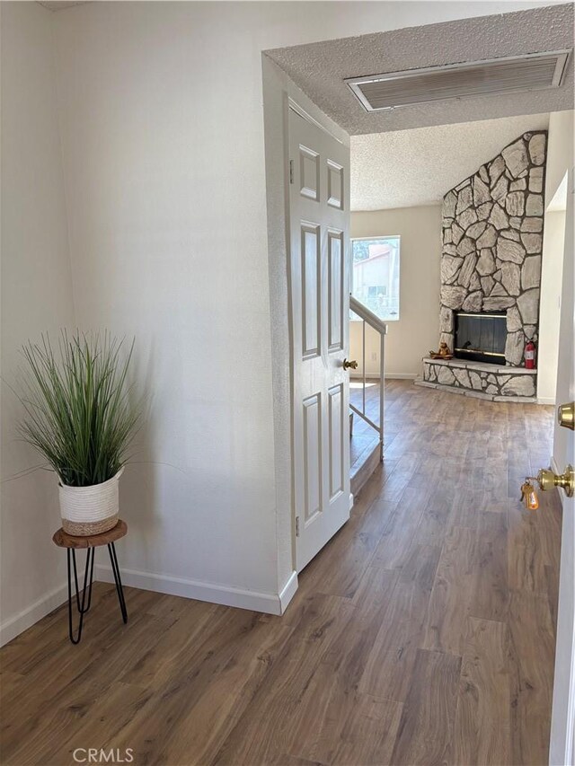 11496 Nautical Ln Unit 19, Helendale, CA 92342 - hall with a textured ceiling and wood finished floors