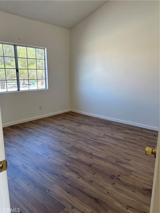 11496 Nautical Ln Unit 19, Helendale, CA 92342 - spare room with baseboards and dark wood-style floors
