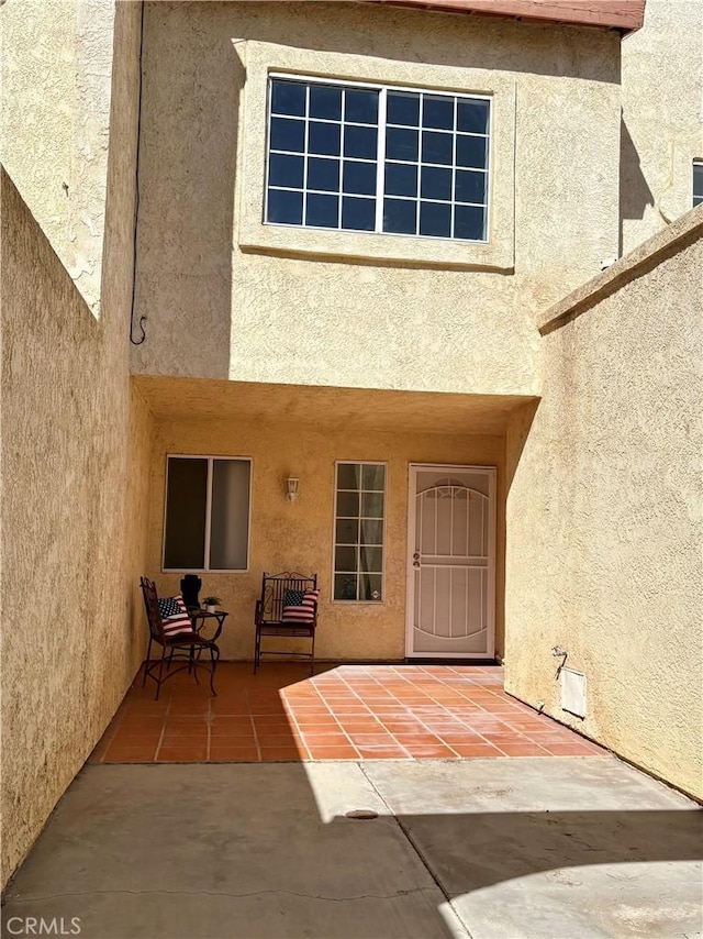 11496 Nautical Ln Unit 19, Helendale, CA 92342 - entrance to property featuring stucco siding and a patio area