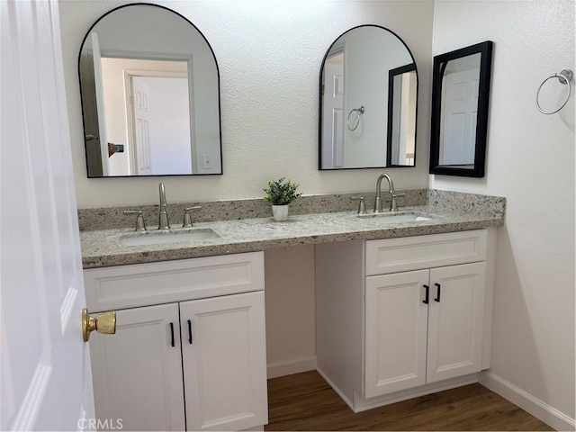 11496 Nautical Ln Unit 19, Helendale, CA 92342 - bathroom featuring double vanity and wood finished floors