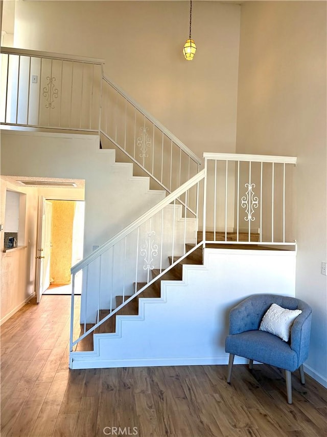 11496 Nautical Ln Unit 19, Helendale, CA 92342 - stairway with wood finished floors and a high ceiling