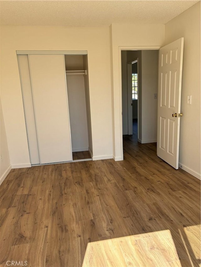 11496 Nautical Ln Unit 19, Helendale, CA 92342 - unfurnished bedroom with a closet and wood finished floors