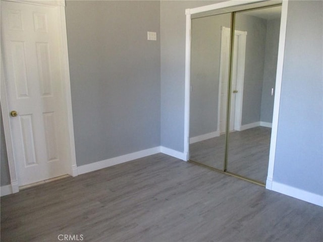 12681 Trask Ave, Garden Grove, CA 92843 - unfurnished bedroom with a closet and wood finished floors