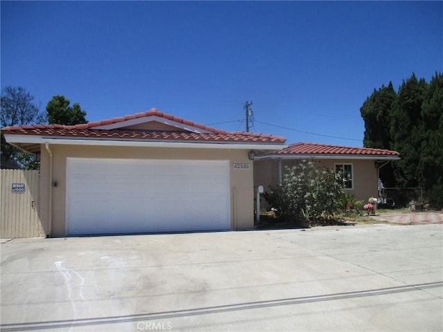 12681 Trask Ave, Garden Grove, CA 92843 - mediterranean / spanish home with stucco siding, driveway, and a tiled roof