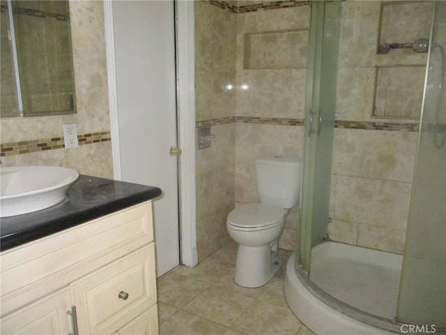 12681 Trask Ave, Garden Grove, CA 92843 - full bath featuring tile walls, vanity, a shower stall, tile patterned floors, and decorative backsplash