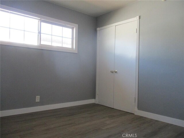 12681 Trask Ave, Garden Grove, CA 92843 - unfurnished bedroom featuring wood finished floors and a closet