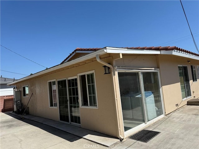 12681 Trask Ave, Garden Grove, CA 92843 - rear view of house with a tiled roof, stucco siding, and a patio