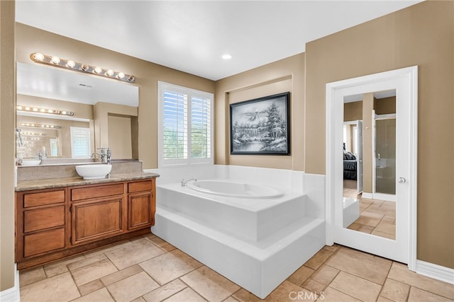 17032 Mountain Crest Ct, Riverside, CA 92503 - ensuite bathroom with vanity and a garden tub
