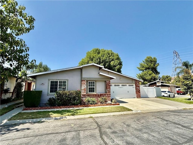 27505 Jasper Way, Castaic, CA 91384 - view of front of property featuring brick siding, driveway, and a garage