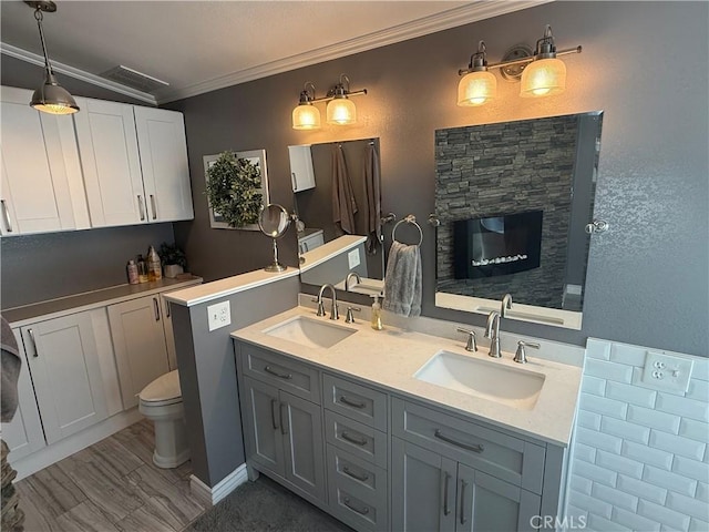 27505 Jasper Way, Castaic, CA 91384 - full bath featuring crown molding, double vanity, and a fireplace