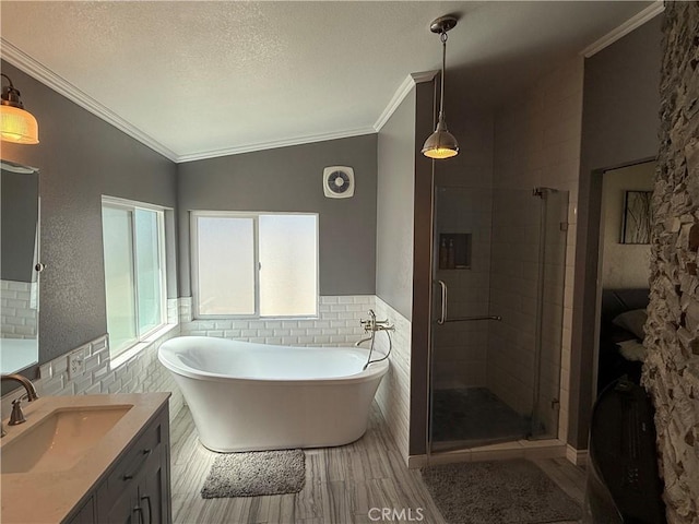 27505 Jasper Way, Castaic, CA 91384 - bathroom with tile walls, vanity, a stall shower, a freestanding tub, and a textured ceiling