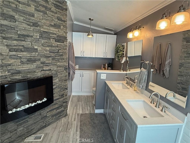 27505 Jasper Way, Castaic, CA 91384 - bathroom with ornamental molding, double vanity, and wood finished floors