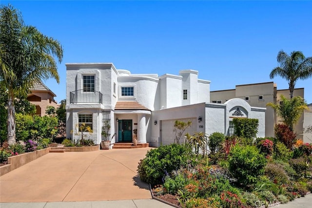 530 Bluerock Dr, San Luis Obispo, CA 93401 - view of front of home featuring a balcony, stucco siding, and concrete driveway