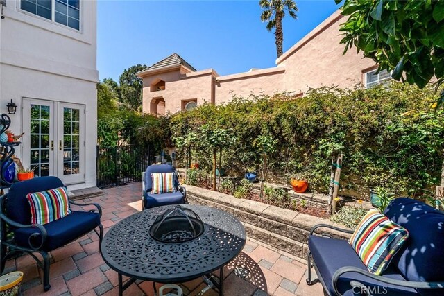 530 Bluerock Dr, San Luis Obispo, CA 93401 - view of patio with french doors and an outdoor fire pit