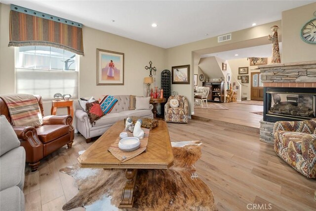 530 Bluerock Dr, San Luis Obispo, CA 93401 - living room featuring hardwood / wood-style floors, a stone fireplace, and recessed lighting