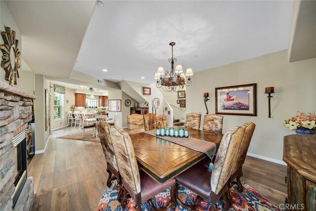 530 Bluerock Dr, San Luis Obispo, CA 93401 - dining area featuring a chandelier, light wood-style floors, a fireplace, and recessed lighting