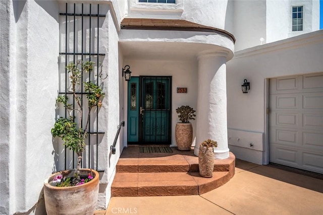 530 Bluerock Dr, San Luis Obispo, CA 93401 - view of exterior entry featuring a garage and stucco siding