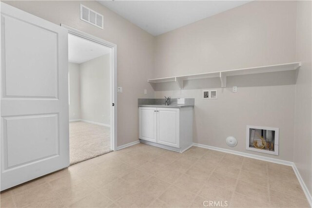 30071 Merrick Ln, Menifee, CA 92584 - laundry room featuring washer hookup, gas dryer hookup, and cabinet space
